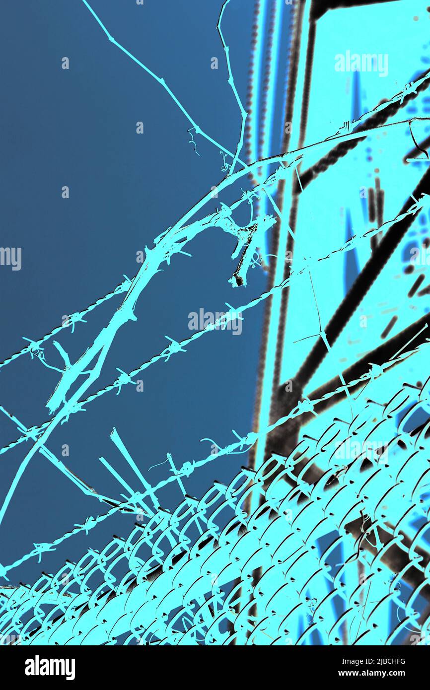 Razor sharp barbed wire fence protecting the industrial area in a