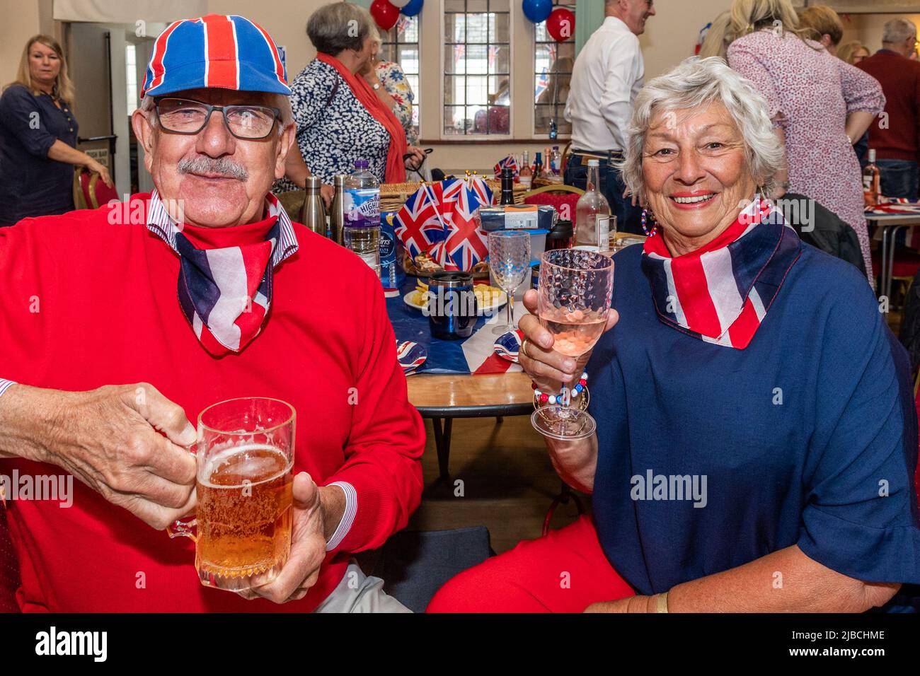 Clifford Chambers, Warwickshire, UK. 5th June, 2022. The picturesque village of Clifford Chambers held a Platinum Jubilee in its village hall today. Enjoying the celebration were Chris and Val Wilks from Clifford Chambers. Credit: AG News/Alamy Live News Stock Photo