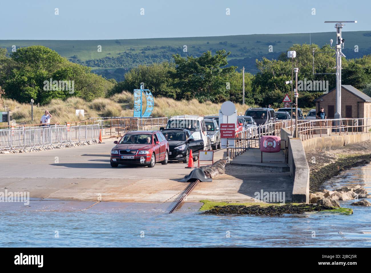 Cars waiting for the Sandbanks Ferry which transports vehicles from Sandbanks to Studland in Dorset, England, UK Stock Photo