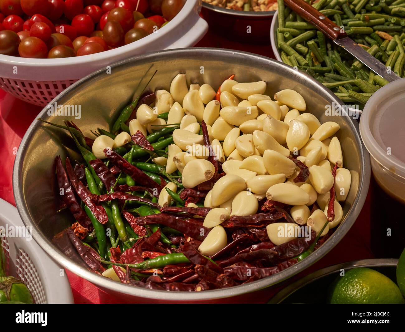 Some of the ingredients for a som tum salad on a street vendor cart, Little Thailand, Queens, New York City, USA Stock Photo