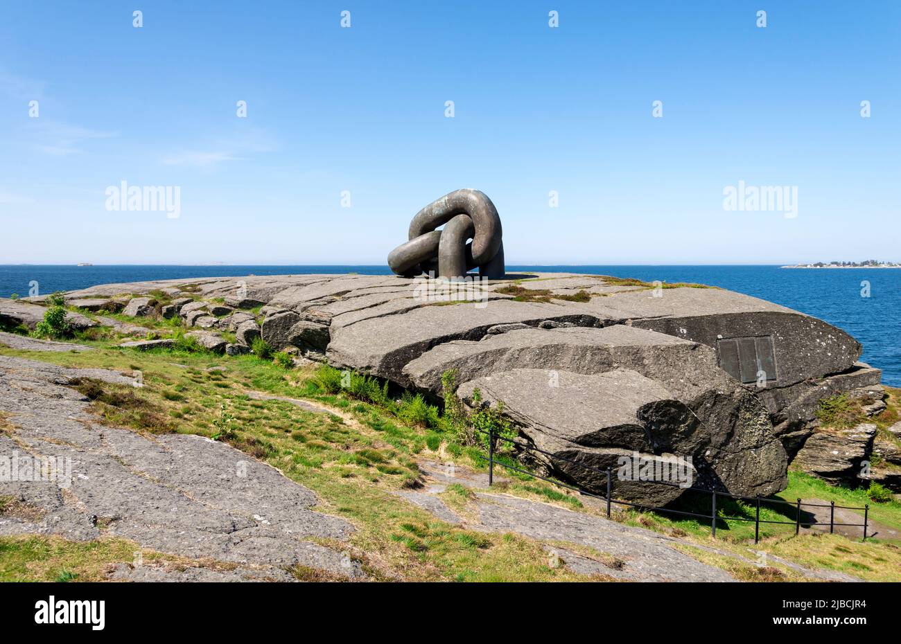 Brutt Lenke or Broken Chain monument on top of a large rock on North Sea coast in Kvernevik suburb, Stavanger, Norway, May 2018 Stock Photo