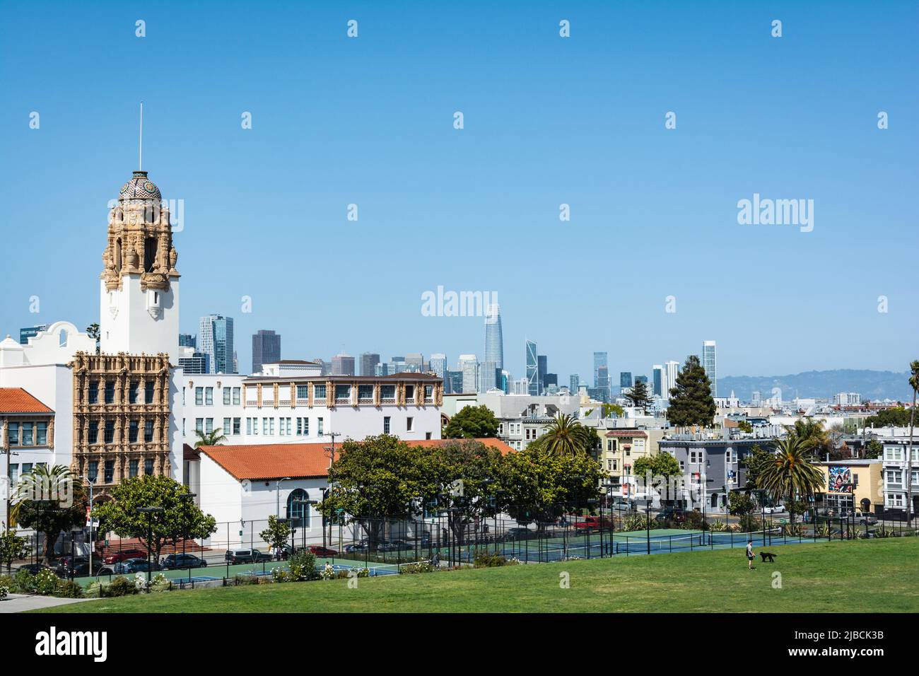 View of Mission Dolores Basilica and San Francisco skyline from Dolores Park, California Stock Photo