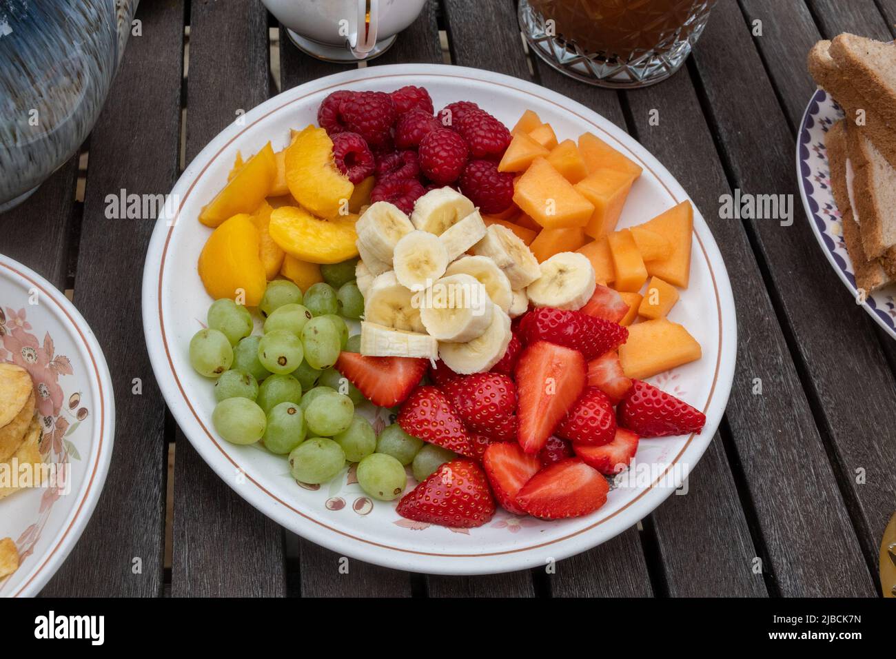 Variety of fruit cut up on a plate for a platinum jubilee family party, UK, June 2022 Stock Photo
