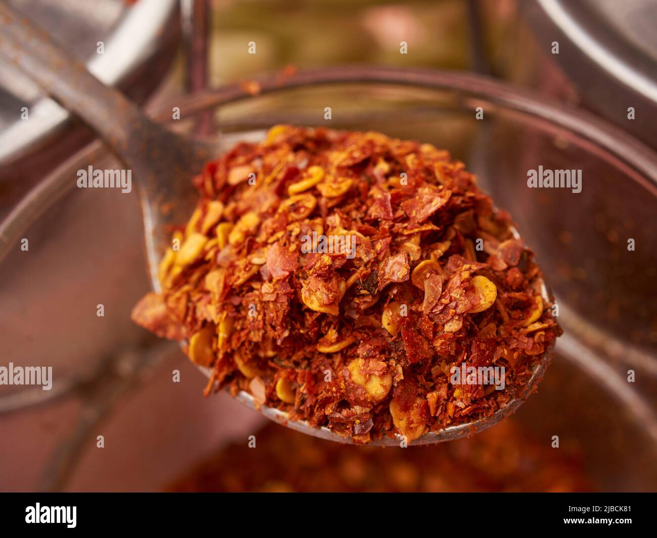 A spoonful of hot chili flakes, Little Thailand, Queens, New York City, USA Stock Photo
