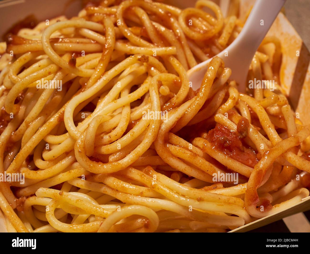 Philapine style sphaghetti with hot dog slices served at a Jollibee fast food restaurant in Queens, NY Stock Photo