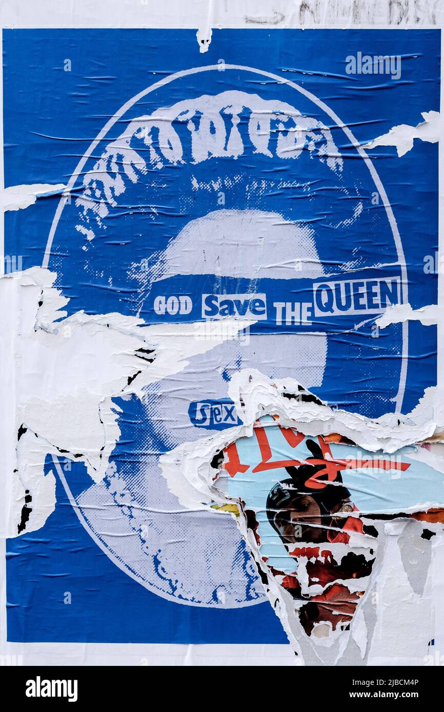 Torn Sex Pistols' God Save The Queen poster, London, UK Stock Photo