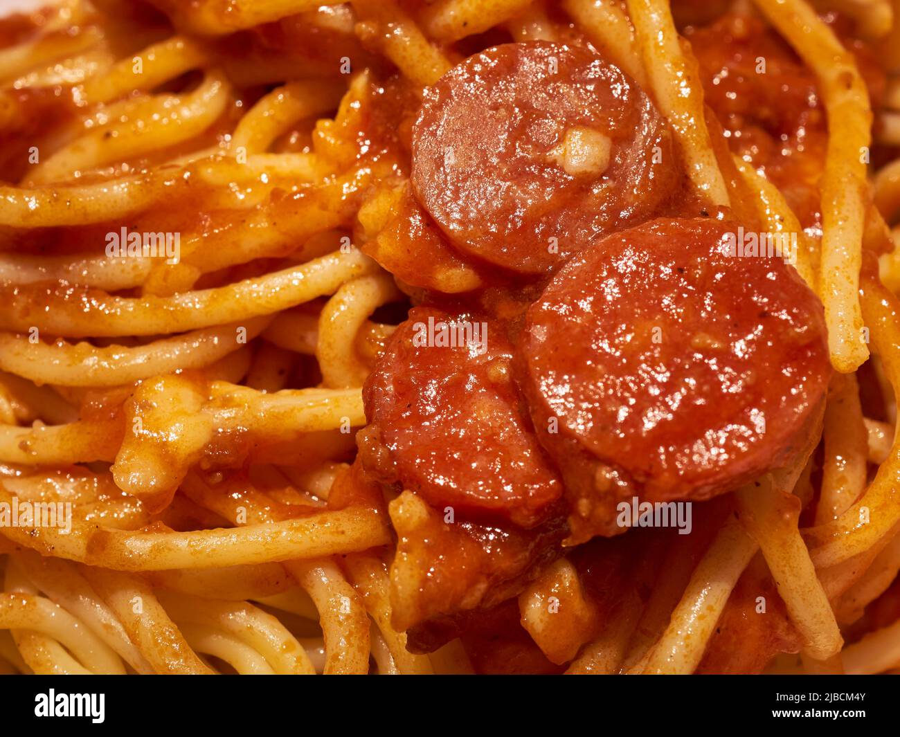 Philapine style sphaghetti with hot dog slices served at a Jollibee fast food restaurant in Queens, NY Stock Photo