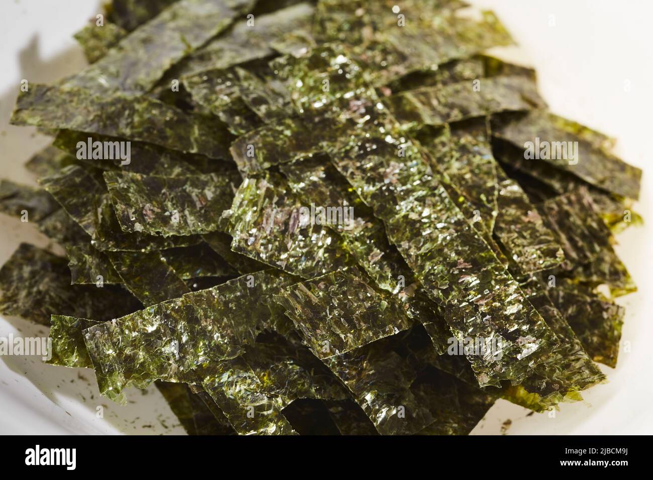 Strips of nori seaweed cut up for garnish Stock Photo