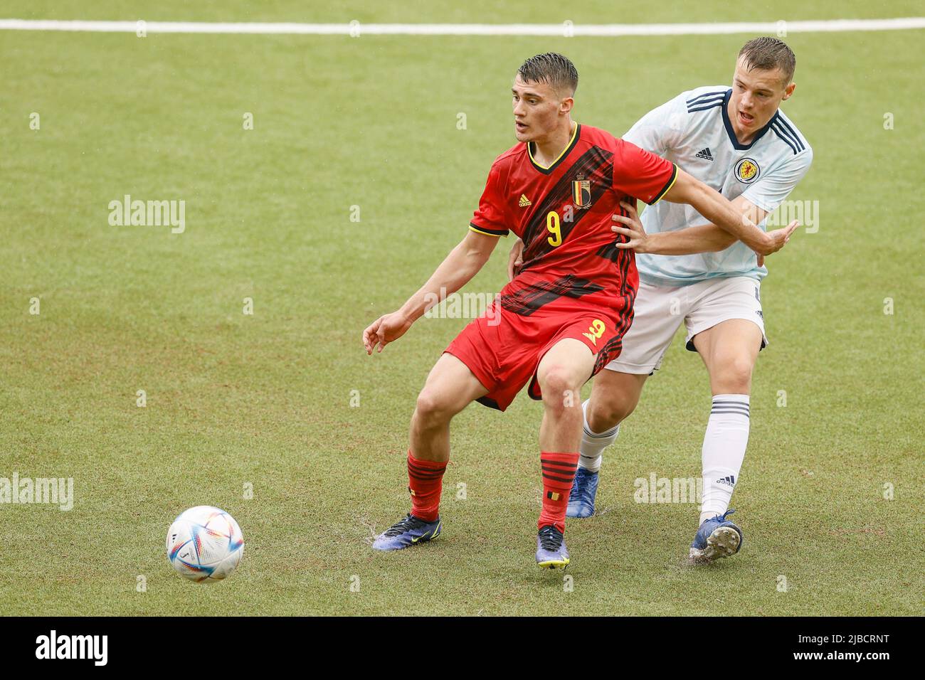 Belgium's Anthony Descotte and Scotland's Lewis Mayo fight for the ball during a soccer game between the U21 teams of Belgium and Scotland, Sunday 05 June 2022 in Sint-Truiden, the last qualification match (out of 8) in the group I, for the 2023 Under-21 European Championships. BELGA PHOTO BRUNO FAHY Stock Photo