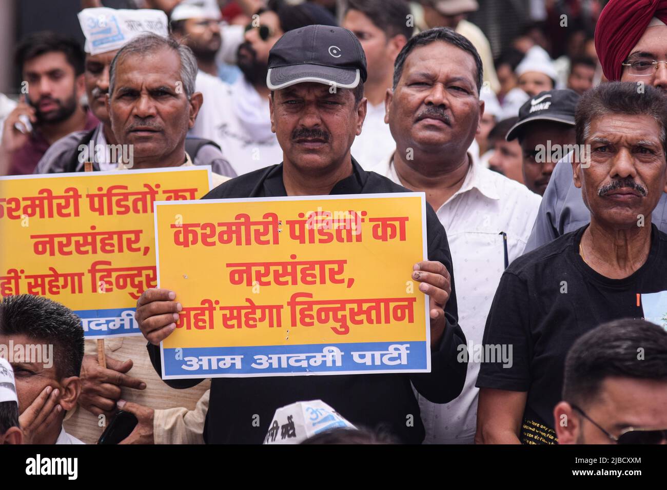 A man holds placard at a Protest held by the Aam Aadmi Party against ...