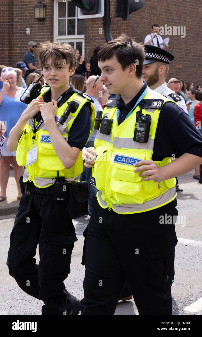 Police cadets UK; Two police cadet members walking in town, Newmarket, Suffolk UK. Example of Police recruitment in England. Stock Photo