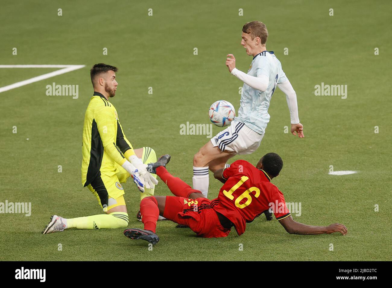 Scotland's goalkeeper Ross Sinclair, Scotland's Tom Clayton and Belgium's Ken Nkuba fight for the ball during a soccer game between the U21 teams of Belgium and Scotland, Sunday 05 June 2022 in Sint-Truiden, the last qualification match (out of 8) in the group I, for the 2023 Under-21 European Championships. BELGA PHOTO BRUNO FAHY Stock Photo