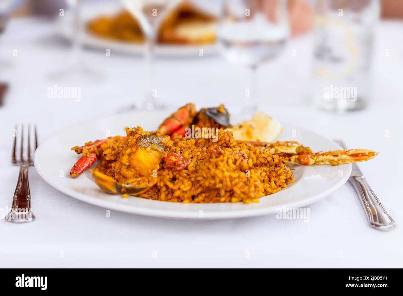 Dish with traditional spanish seafood paella with mussels, langoustine ...