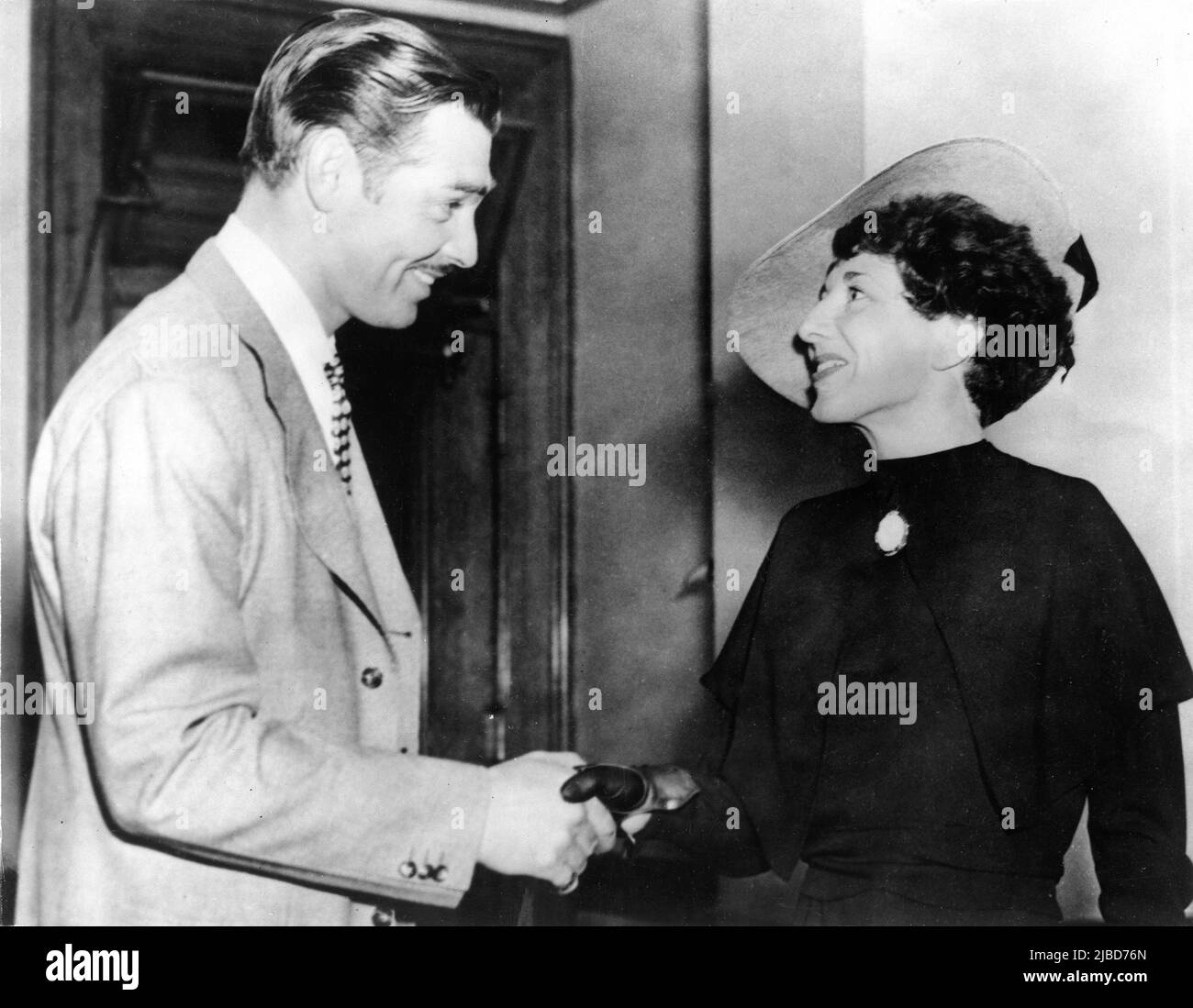 CLARK GABLE in April 1937 meets his old sweetheart FRANZ DORFLER / DOERFLER at a Los Angeles Courtroom when she appeared as a witness on his behalf when he was falsely charged with being the father of the 13 year old daughter of English woman Violet Wells Norton when he was supposedly in England living under the name of Frank Billings in 1922. Stock Photo