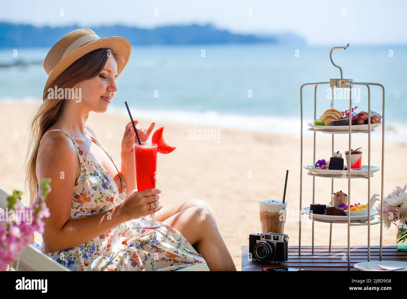 Summer vacation. Travel woman on tropical holidays, enjoy fresh watermelon shake Stock Photo