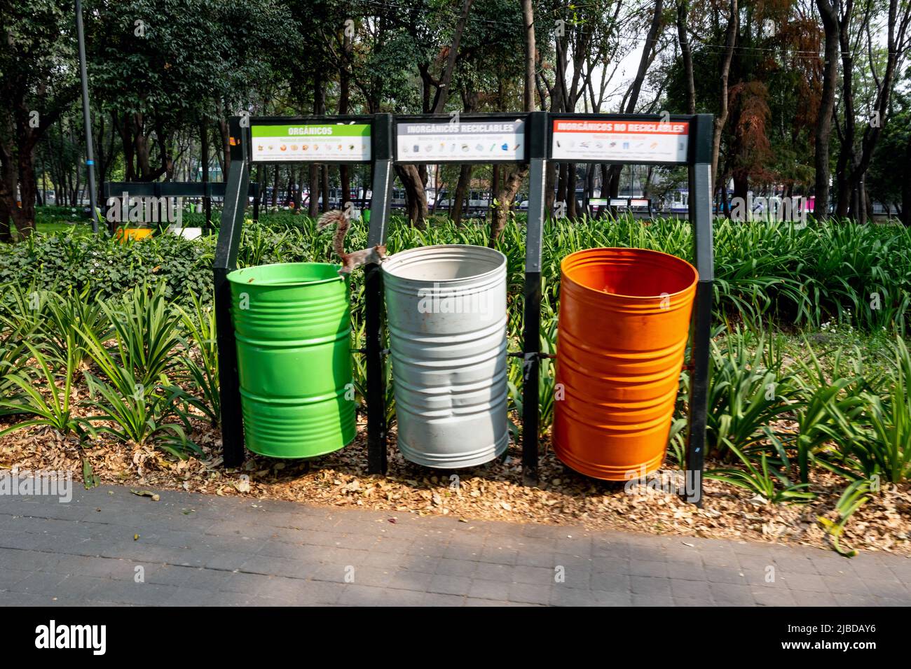Mexico City, January 17th 2019: Colour-coded rubbish bins, left to right, organic goods, inorganic recyclables and inorganic non-recyclables Stock Photo