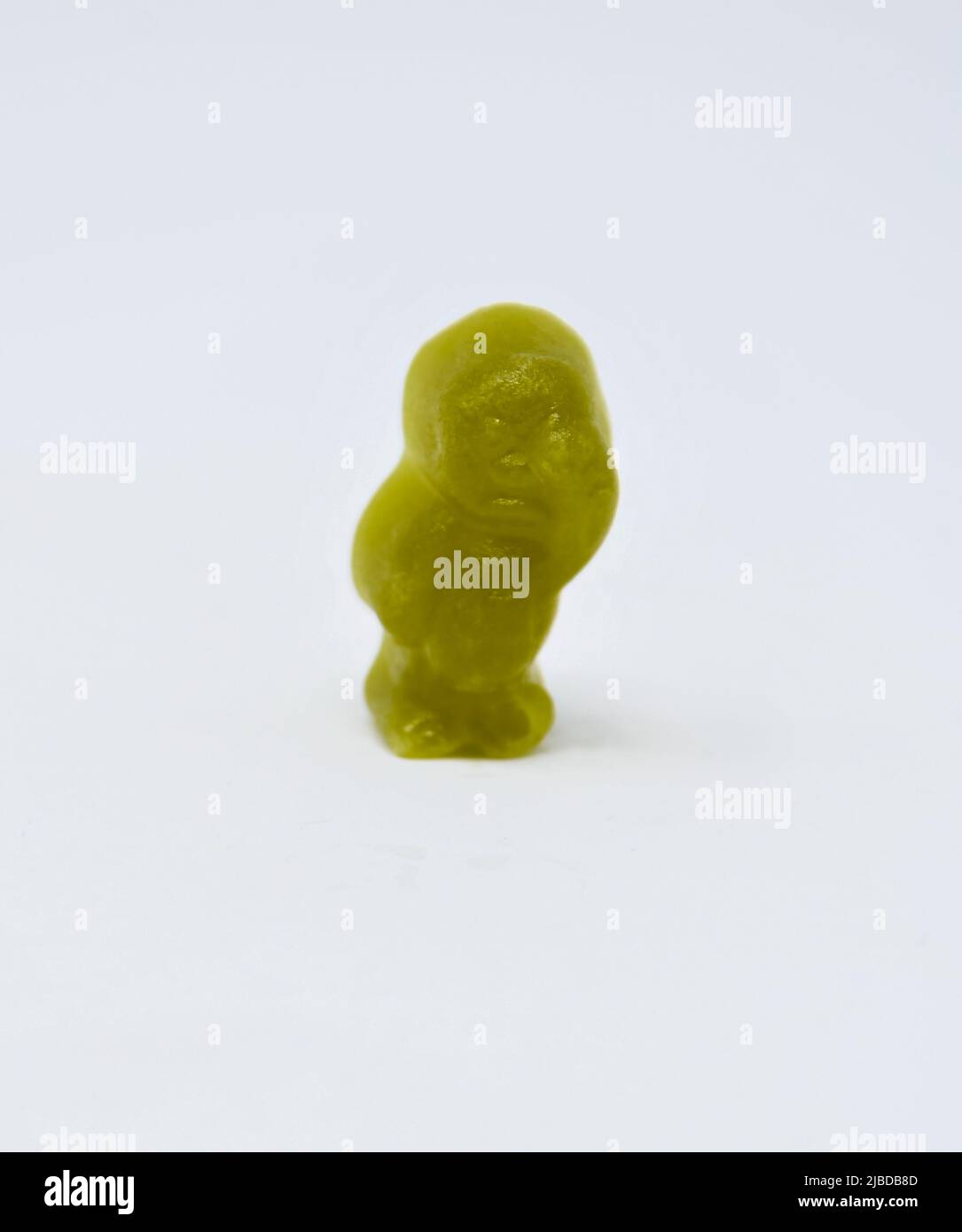 A close up photo of a Green Jelly baby Stock Photo