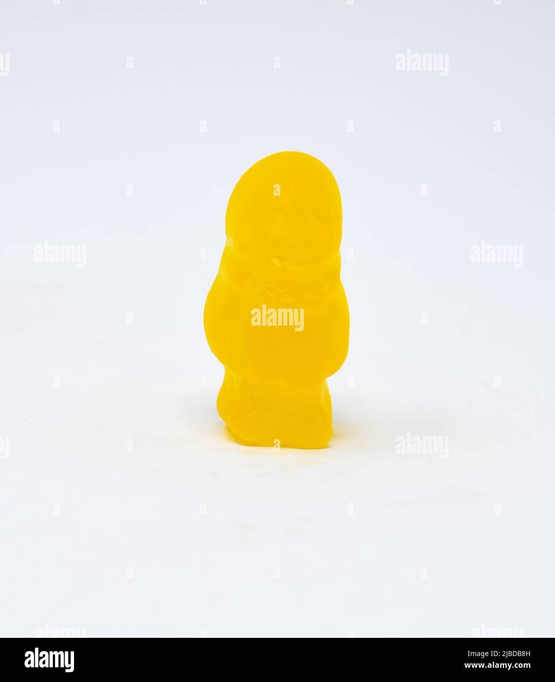 A close up photo of a Yellow Jelly baby Stock Photo