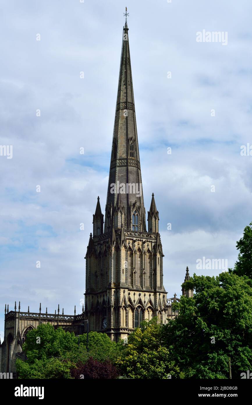 A lovely steeple of St Mary Redcliffe Church with trees in the foreground Stock Photo