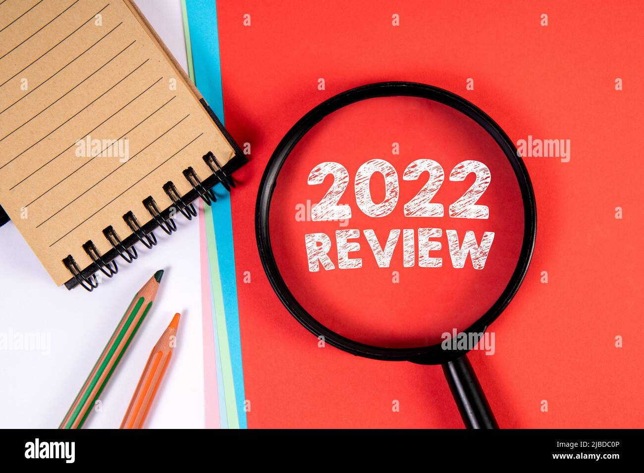 2022 Review. Magnifying glass on a red background Stock Photo - Alamy