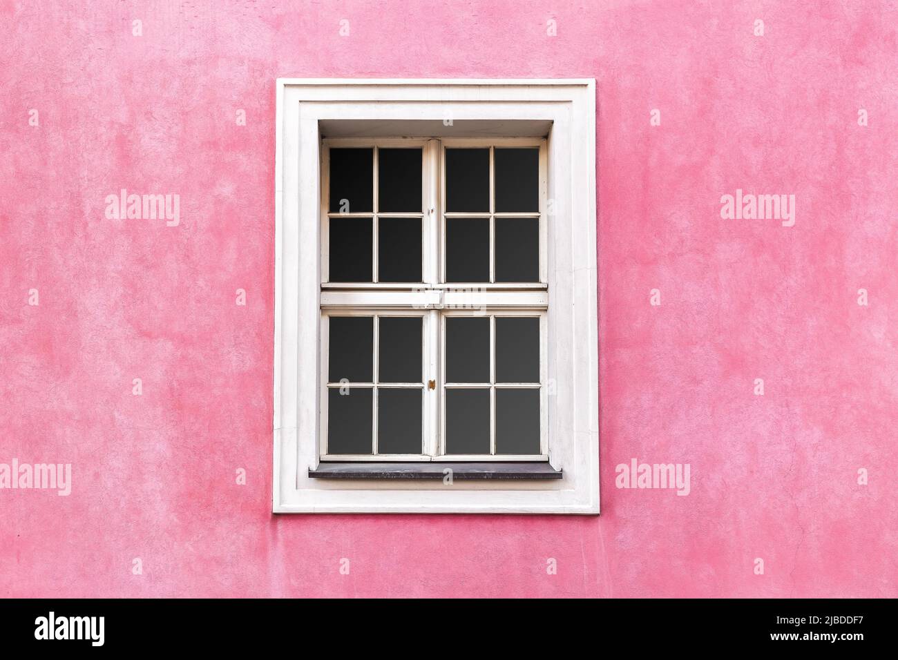 Renaissance style window with white frame on pink wall color. Building ...