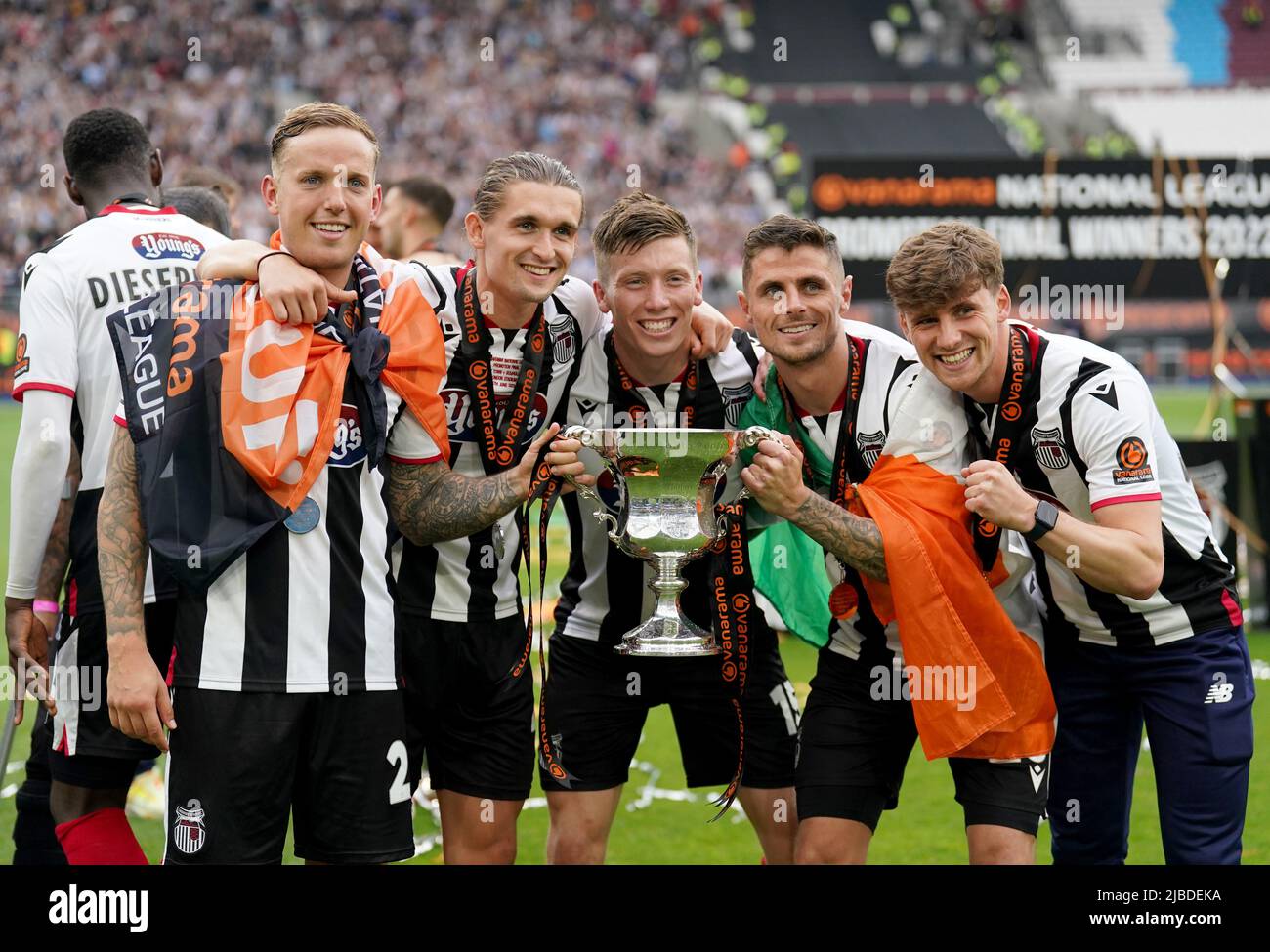Grimsby Town players pose with National League play off final trophy after after their win during the Vanarama National League play off final match at the London Stadium, London. Picture date: Sunday June 5, 2022. Stock Photo