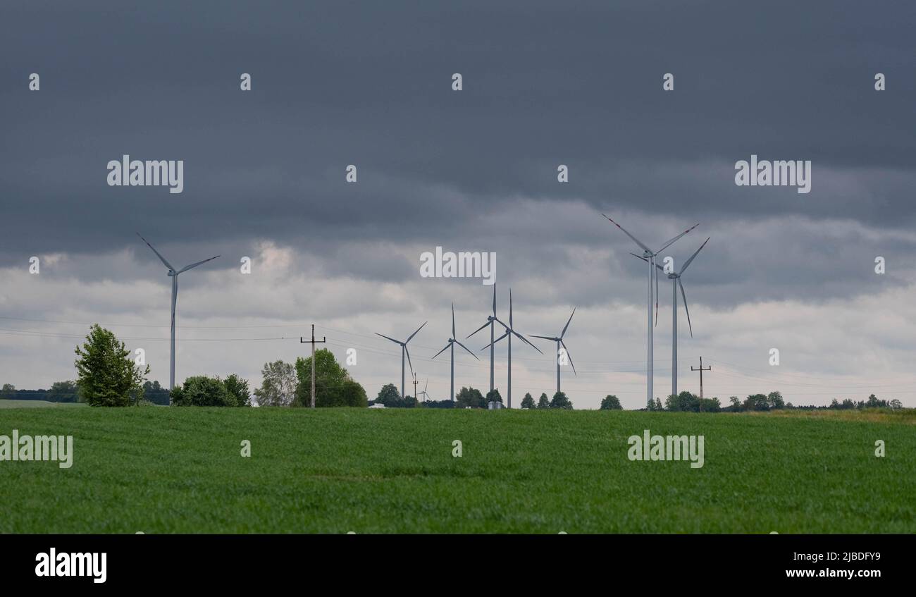 Wind farm in Poland. Windmills in arable fields. Renewable energy