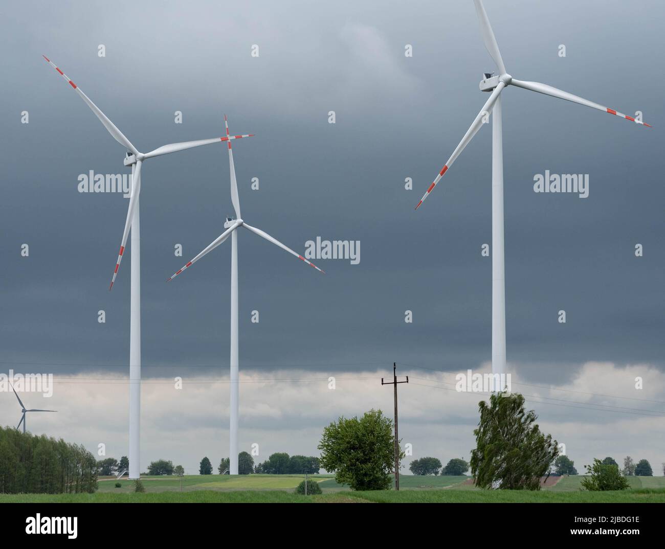 Wind farm in Poland. Windmills in arable fields. Renewable energy