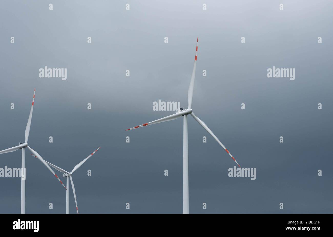 Wind farm in Poland. Windmills in arable fields. Renewable energy