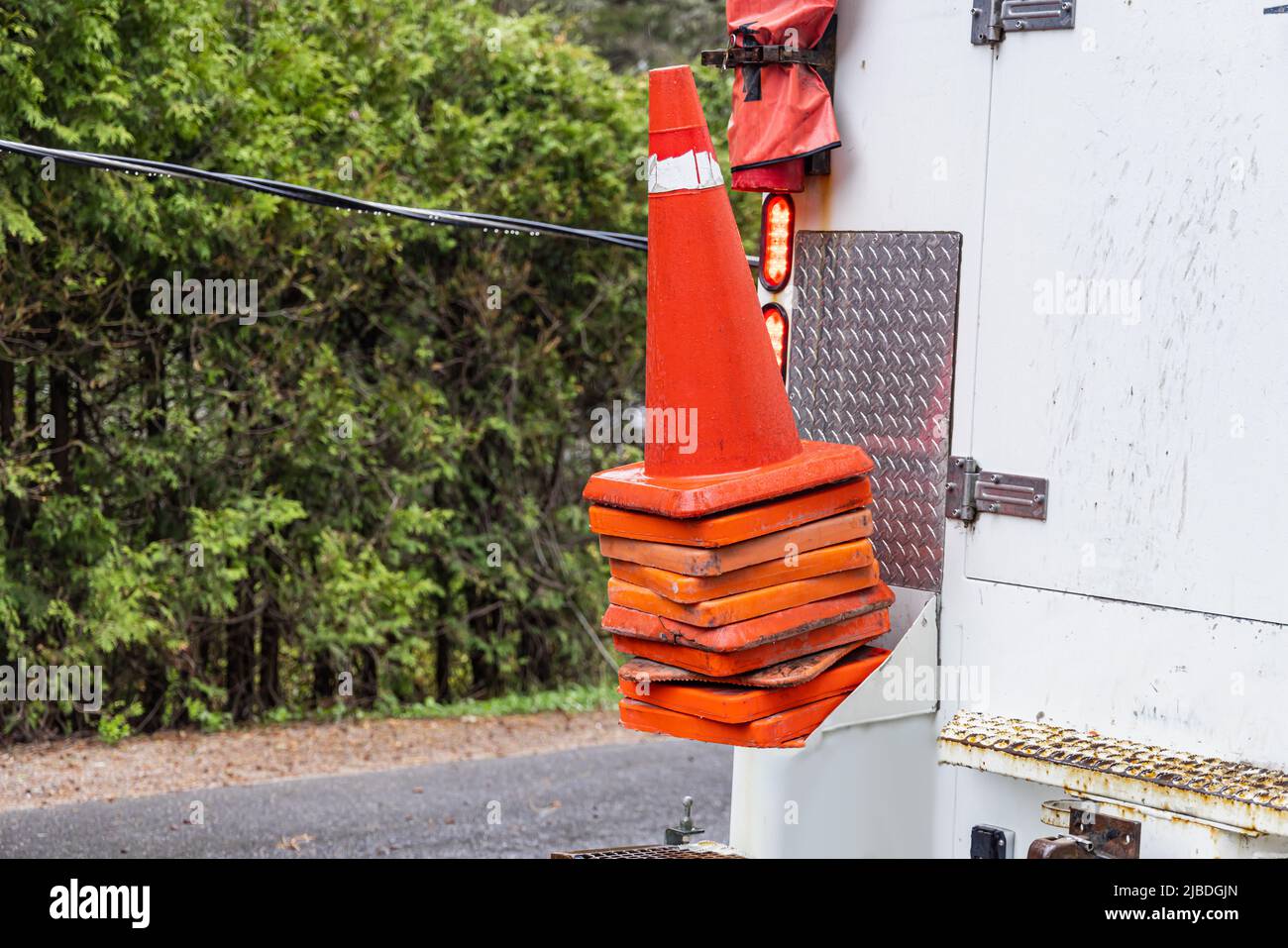 Closeup view of high visibility traffic cones on the rear of a roadwork