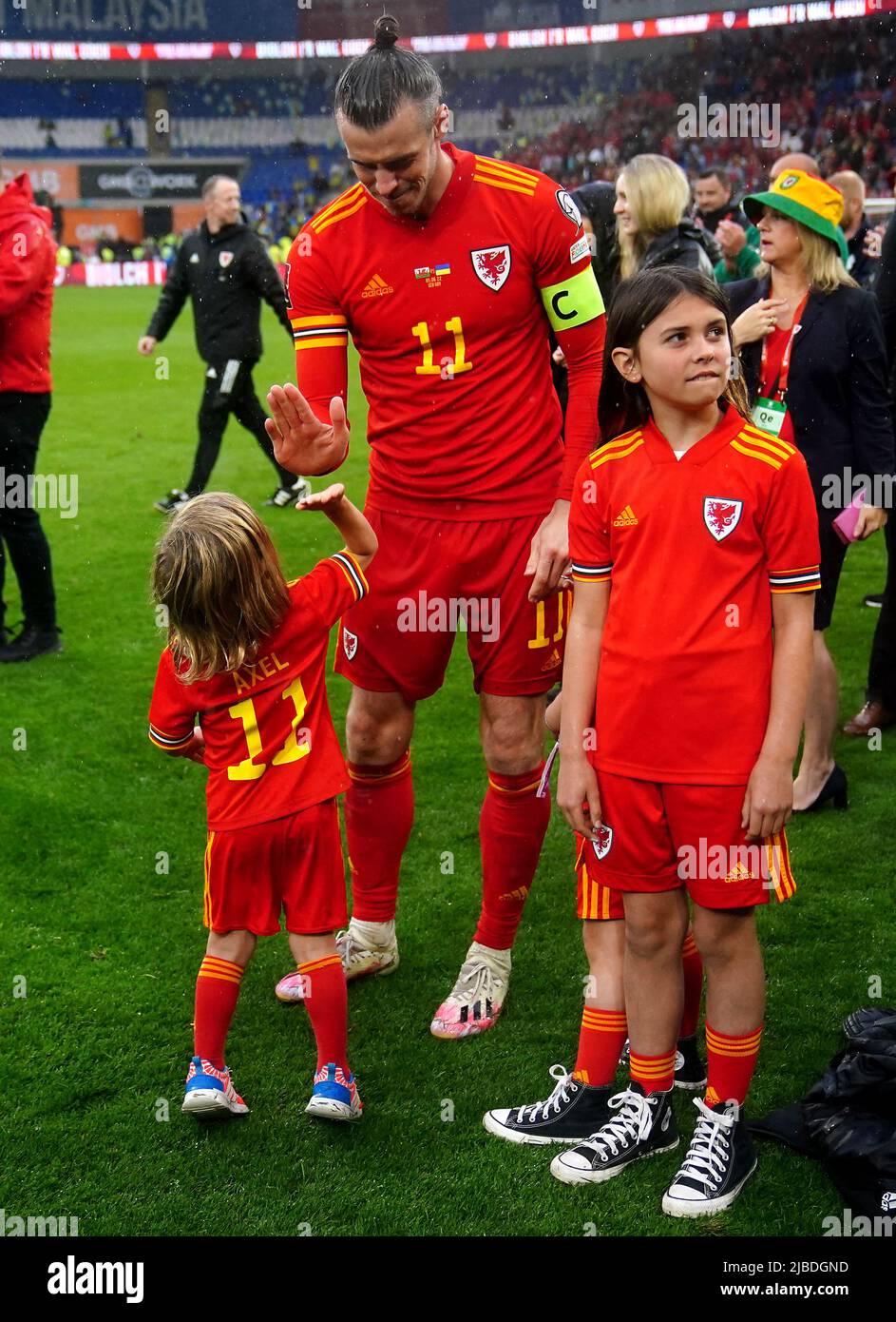Wales' Gareth Bale (centre) with their children including Axel Charles Bale  (left) after the final whistle in the FIFA World Cup 2022 Qualifier  play-off final match at Cardiff City Stadium, Cardiff. Picture