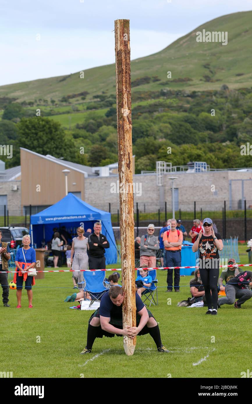 Girvan, UK. 05th June, 2022. After an absence of two years because of Covid restrictions, the Carrick Lowland Games returned to Girvan in South Ayrshire with the regular traditional highland dancing competitions, piping competitions and the ever popular heavyweight highland sports of tossing the stone, throwing the hammer, clearing the bar and tossing the caber. Some well known sports personalities attended including Neil Elliot, from Helensburgh, a former Champion of The Games. Credit: Findlay/Alamy Live News Stock Photo