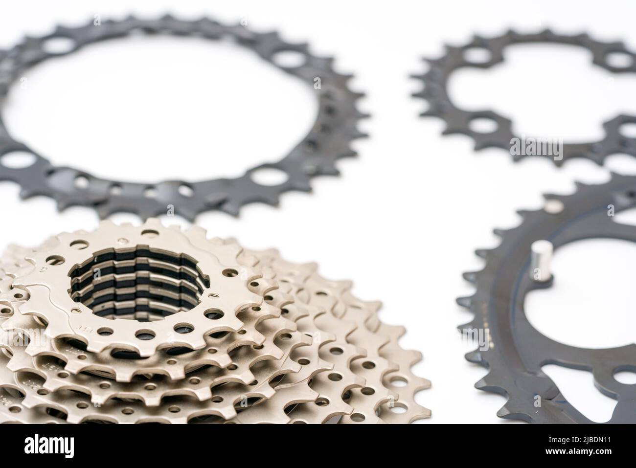 Gears, sprockets and chain of a mountain sports bike on a white background. Bicycle parts Stock