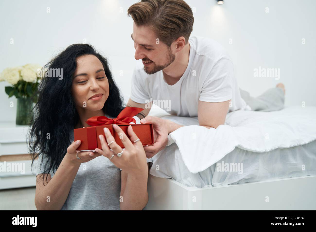 Romantic man presenting gift to his happy life partner Stock Photo Alamy