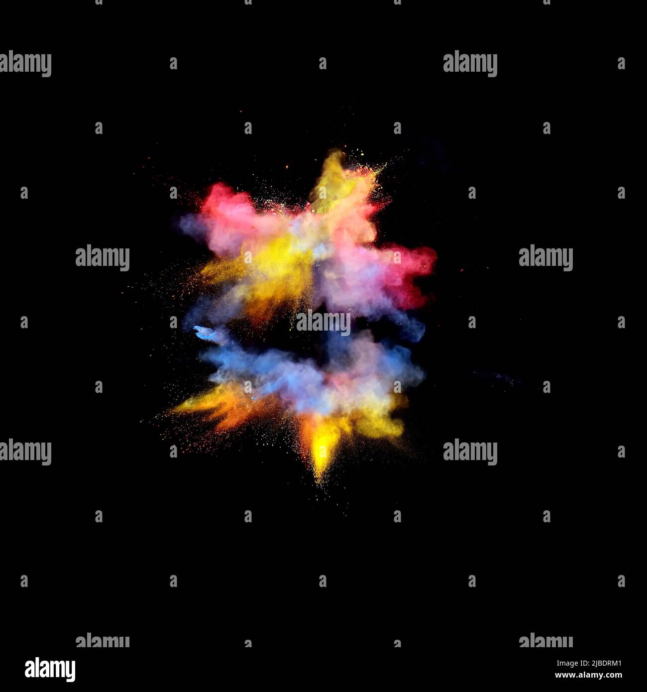 Various multicolored forms of powder paint explode in front of a black ...