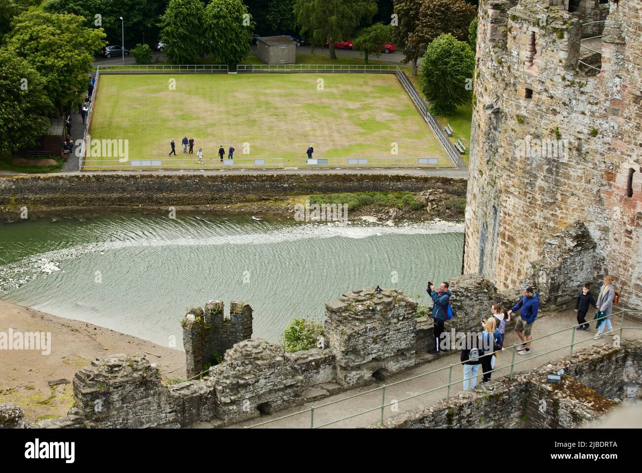Conwy, North Wales landmark medieval defensive structure Conwy Castle with the local bowling green in view Stock Photo