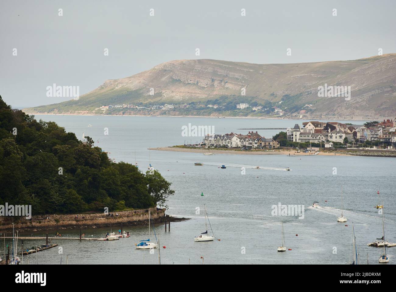Conwy, North Wales, River Conwy waterfront pier and marina with Deganwy behind and Llandudno’s Great Orme Stock Photo