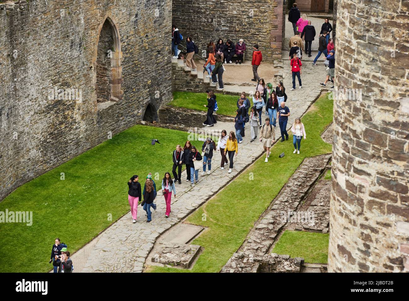 Conwy, North Wales landmark medieval defensive structure Conwy Castle tourists inside the castle Stock Photo