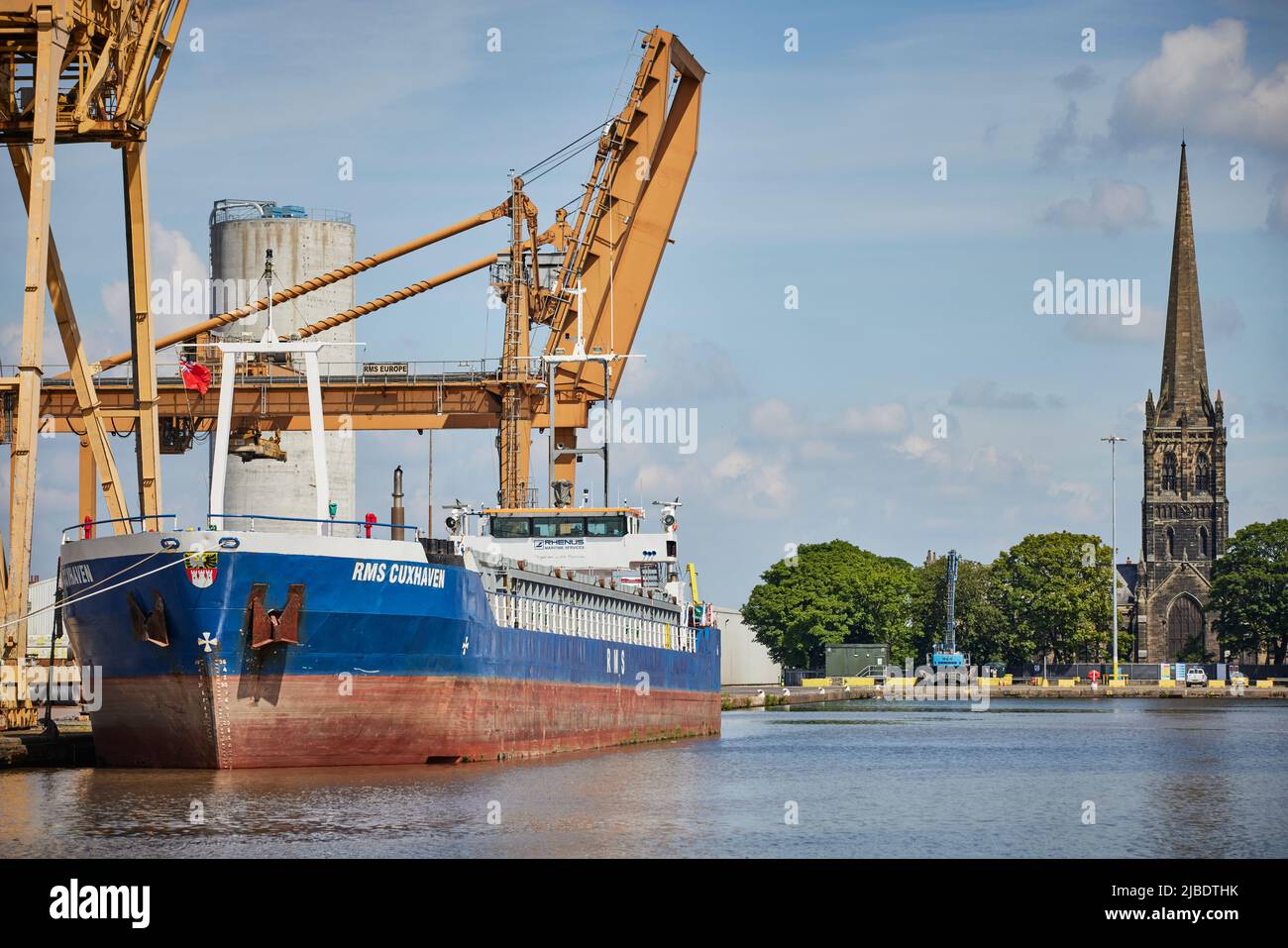 port of Goole docks, a Tom Pudding hoist in Goole docks with St John's Goole behind and vessel RMS CUXHAVEN in dock Stock Photo