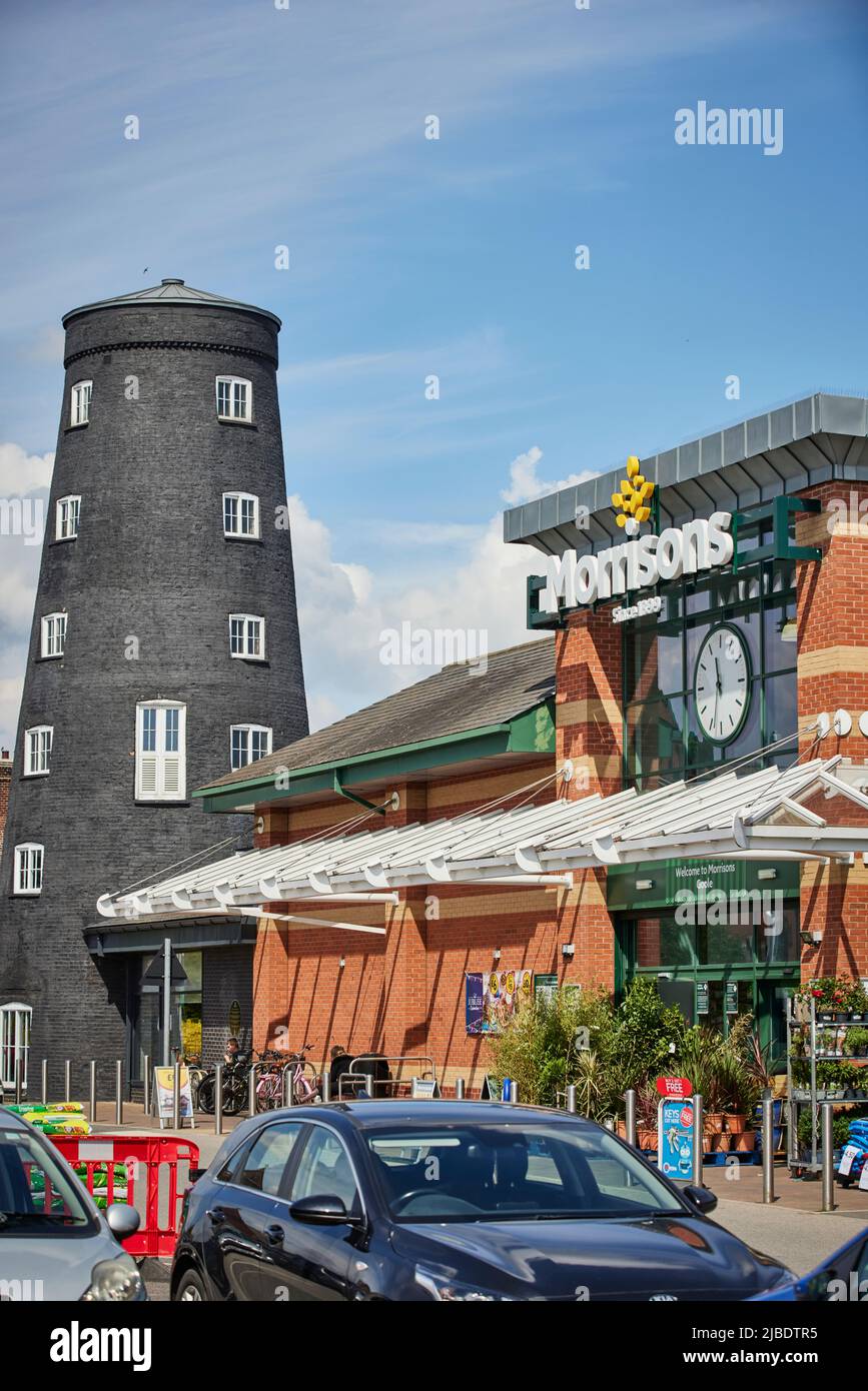 Timms Mill Grade II Listed disused windmill and Morrisons supermarket  adjoining cafe Goole, East Yorkshire, England UK Stock Photo