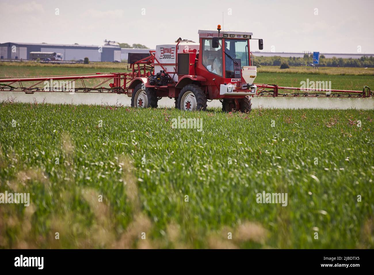 Crop spraying  Goole, East Yorkshire, England UK Stock Photo