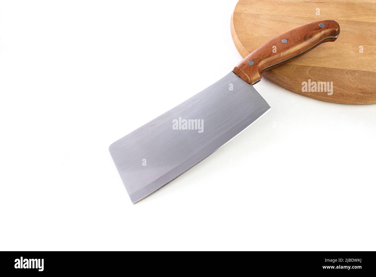 Chef's kitchen knife lay on wooden board and white background. Chef, restaurant or kitchen concept. Stock Photo