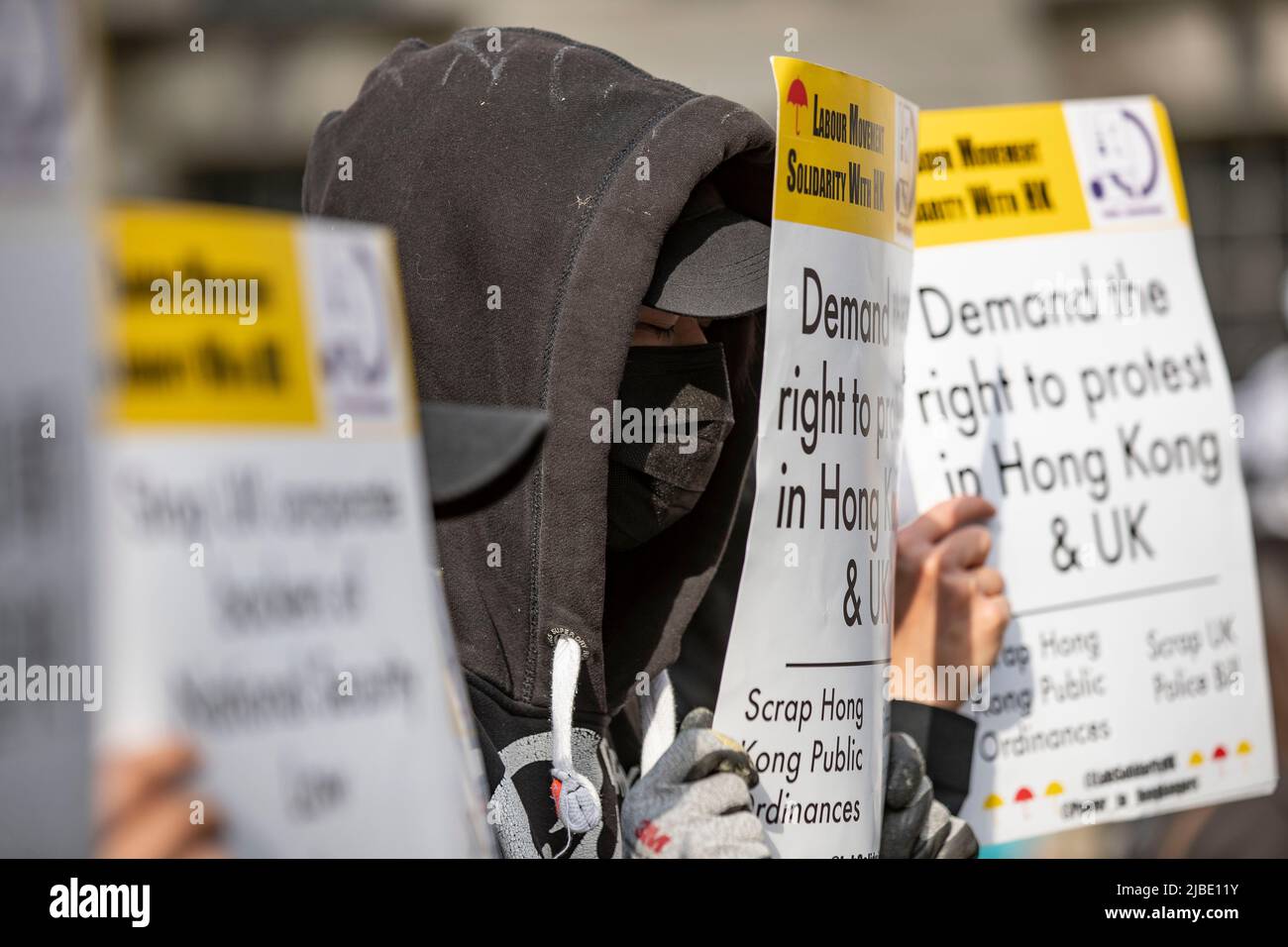 Protesters hold placards expressing their opinions during the rally outside Downing Street against authoritarian regimes in China and Russia in London. A joint rally of Ukrainian & Hongkongers calling for “Unite for Democracy” organised by Democracy for Hong Kong, Hong Kong Aid, Hong Kong Liberty, Fight for Freedom, Stand with Hong Kong, Hong Kong Assistance and Resettlement Community and Hongkongers in Britain on the day of 33rd anniversary of the Tiananmen Square Massacre. (Photo by May James / SOPA Images/Sipa USA) Stock Photo