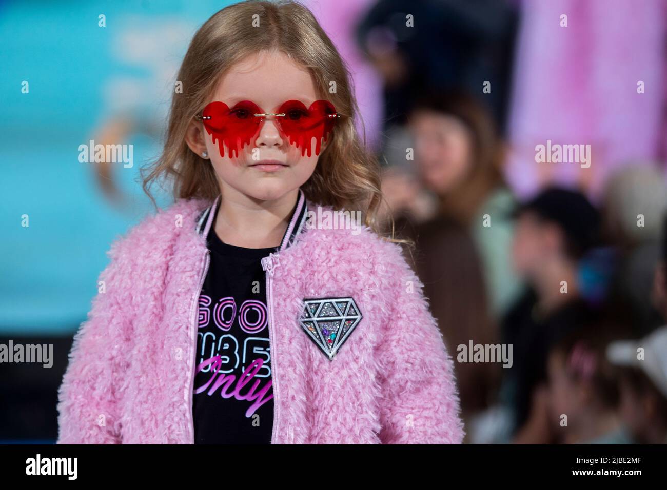 Moscow, Russia. 5th of June, 2022. Young model shows children's clothing collection of Choupette brand on a podium during the Fashion show 'Circus', in the Moscow Children's Store as part of the celebration of the 65th anniversary of the store, Russia Stock Photo