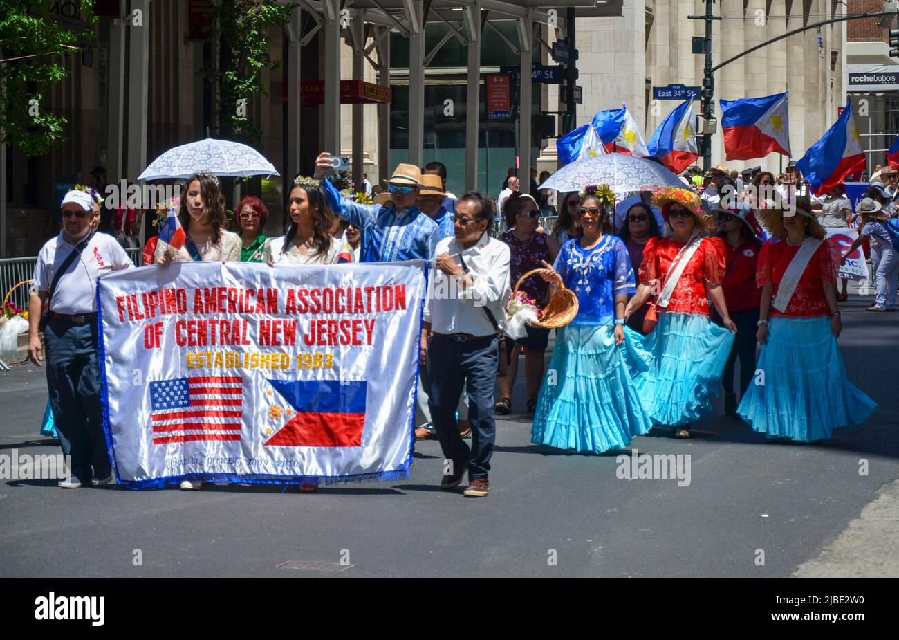 Participants march up Madison Avenue holding Philipino flag in New York