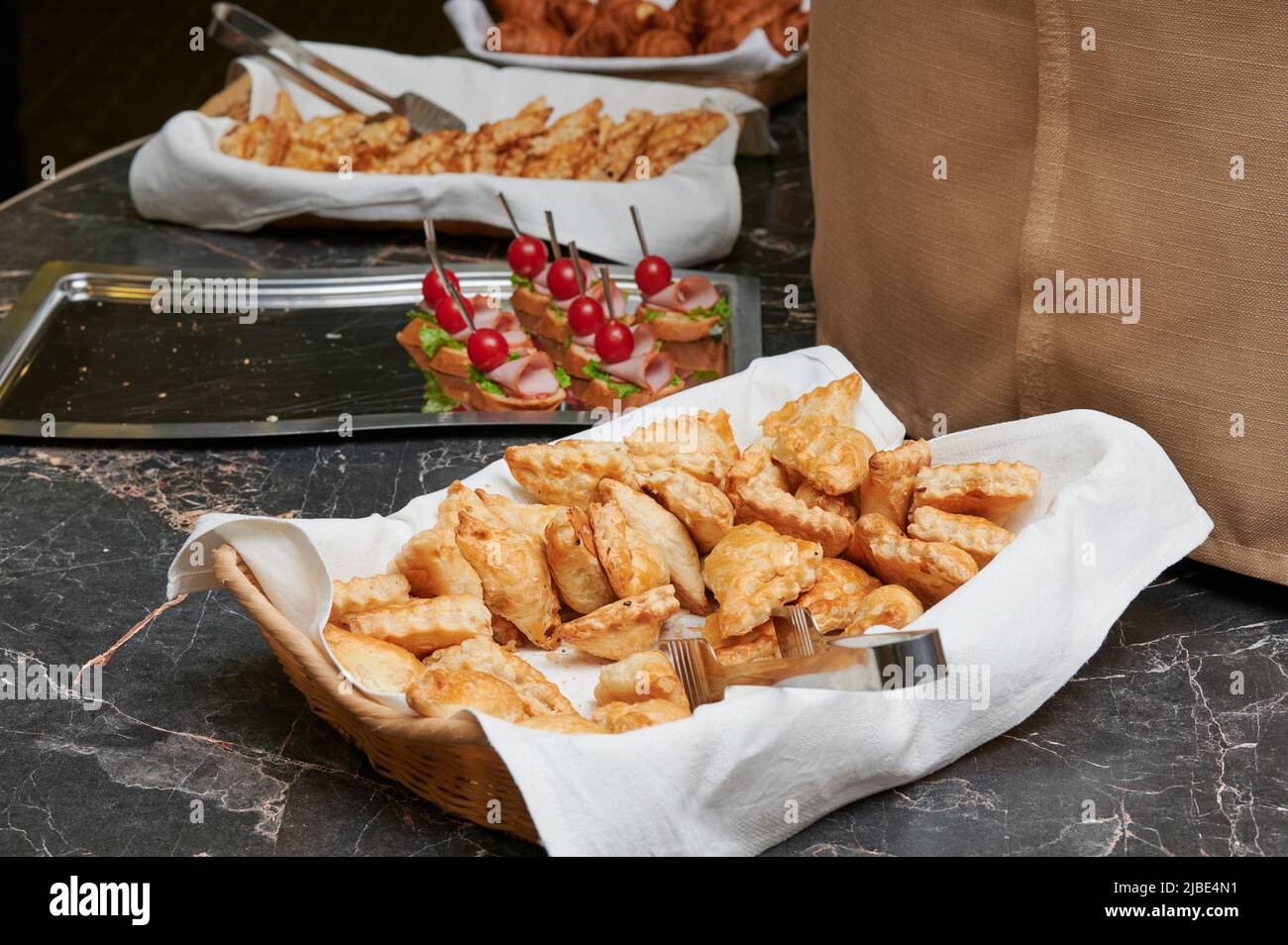 Puff pastry, triangles with cheese from sheet dough Stock Photo - Alamy