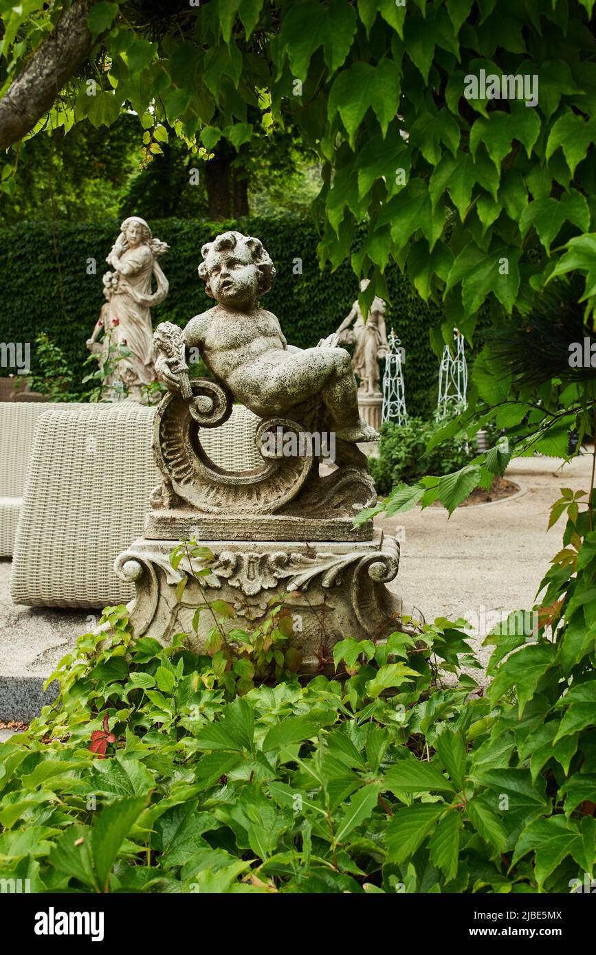 stone garden sculptures in landscape design in the park Stock Photo Alamy