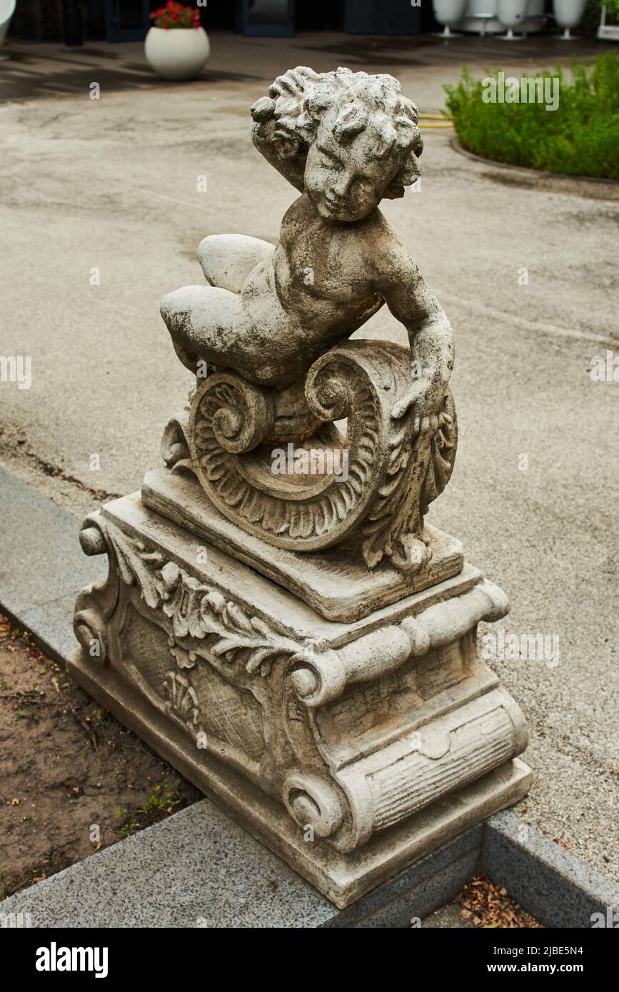 stone garden sculptures in landscape design in the park Stock Photo Alamy