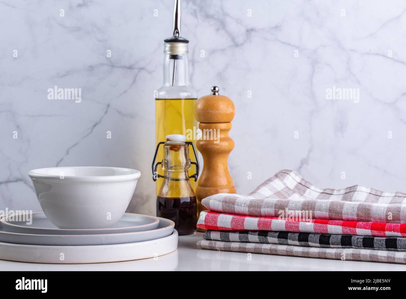 linen towels in a stack on the kitchen table Stock Photo