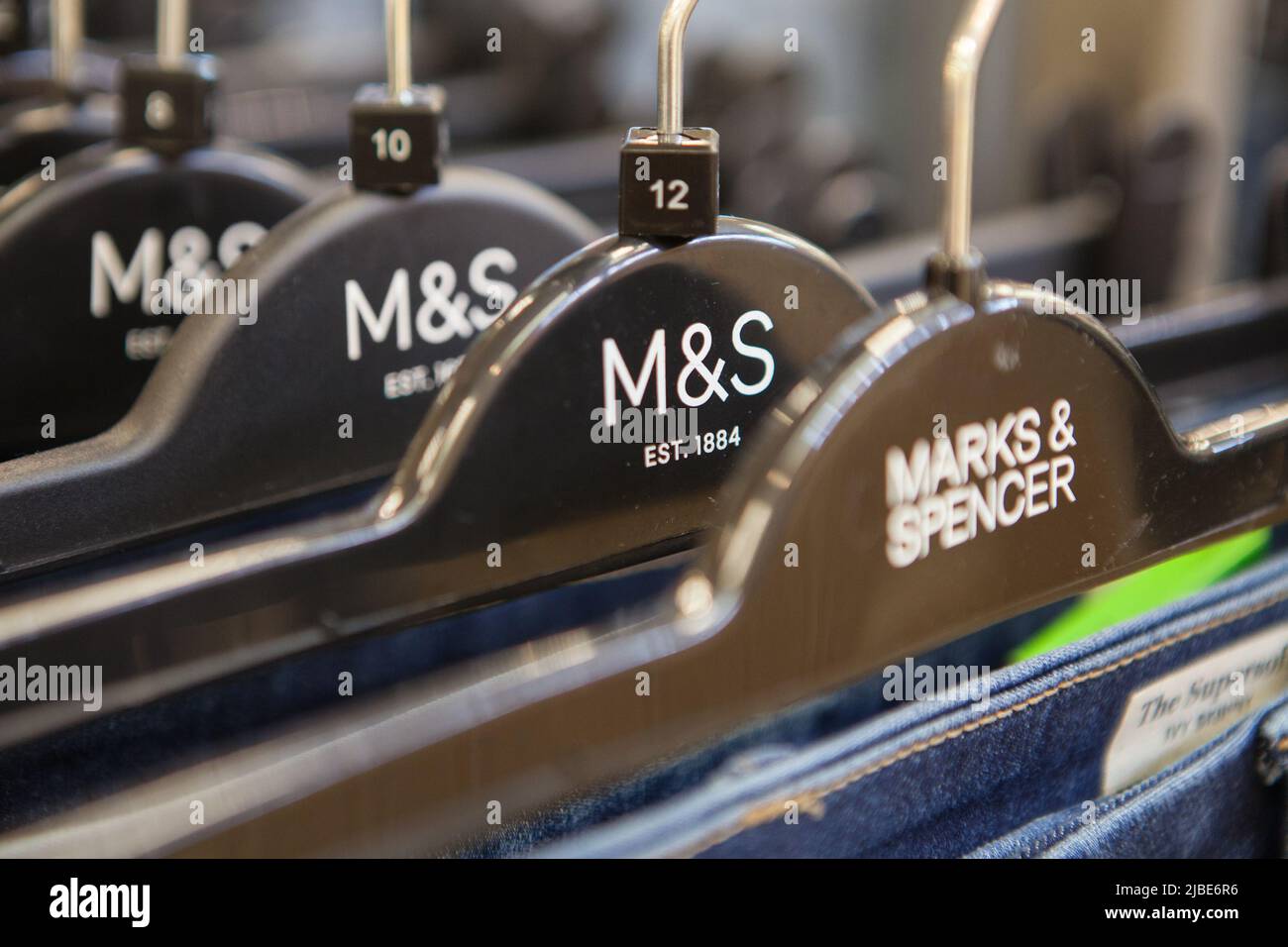 Clothing hangers in a Marks & Spencer store Stock Photo